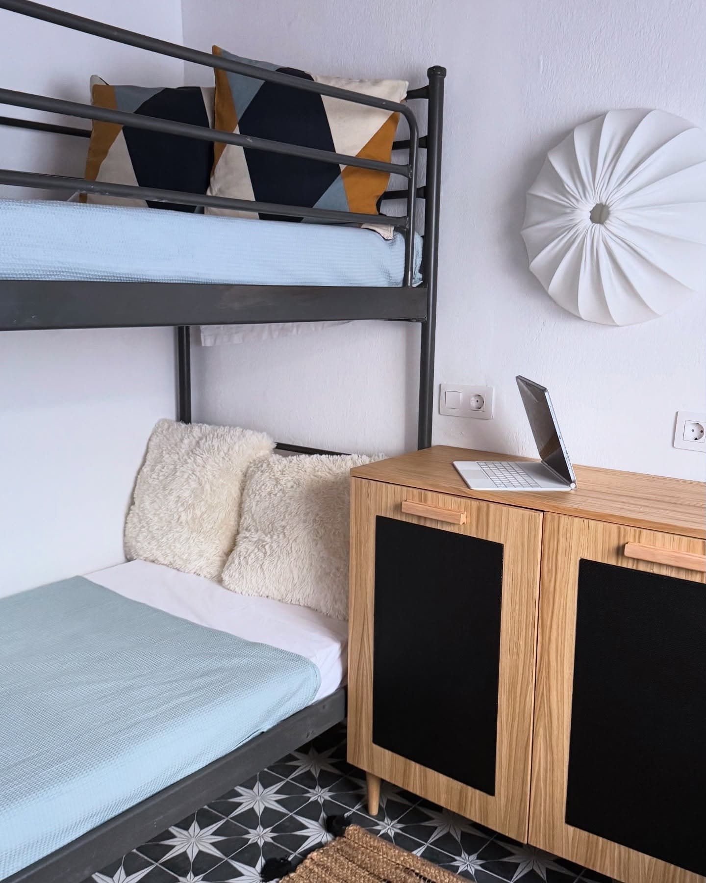 Boho bedroom with bunk bed and star floor tiles