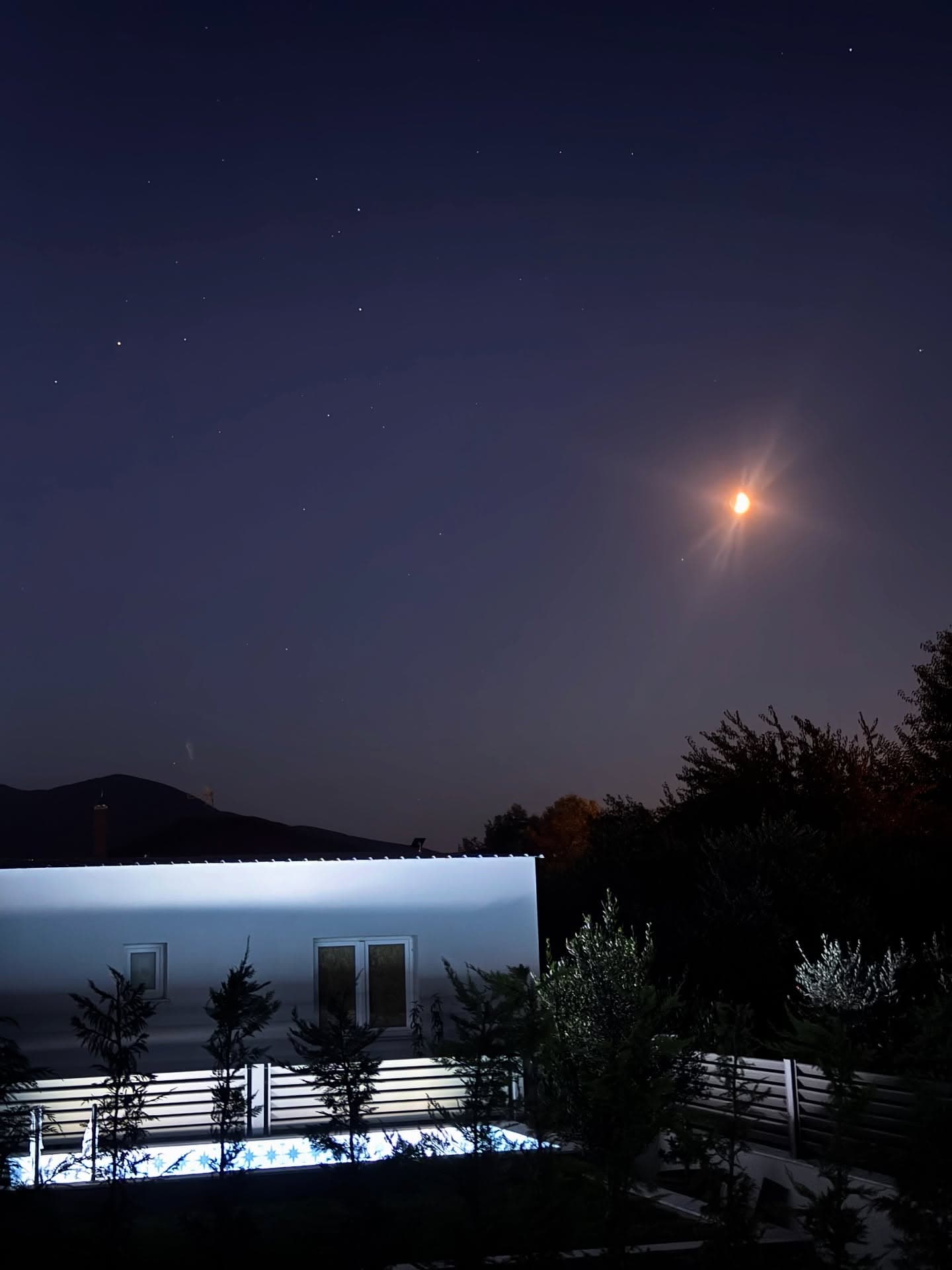 Moonlit night sky over the property